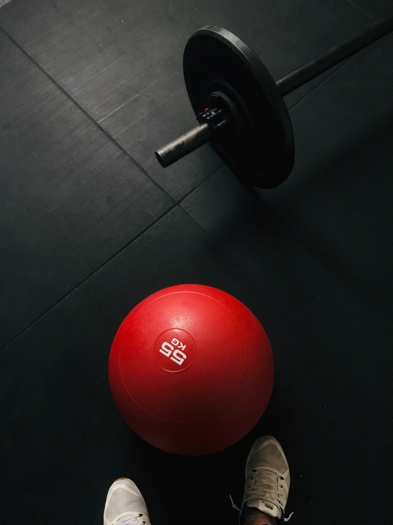 Medicine ball and loaded barbell 
