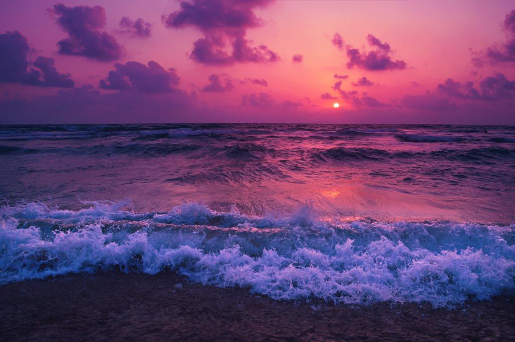 Purple sky over ocean 
