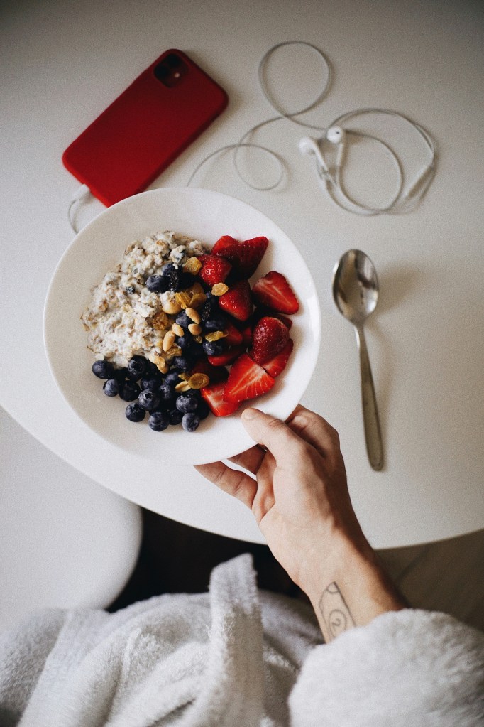 Bowl of oatmeal and fruits 