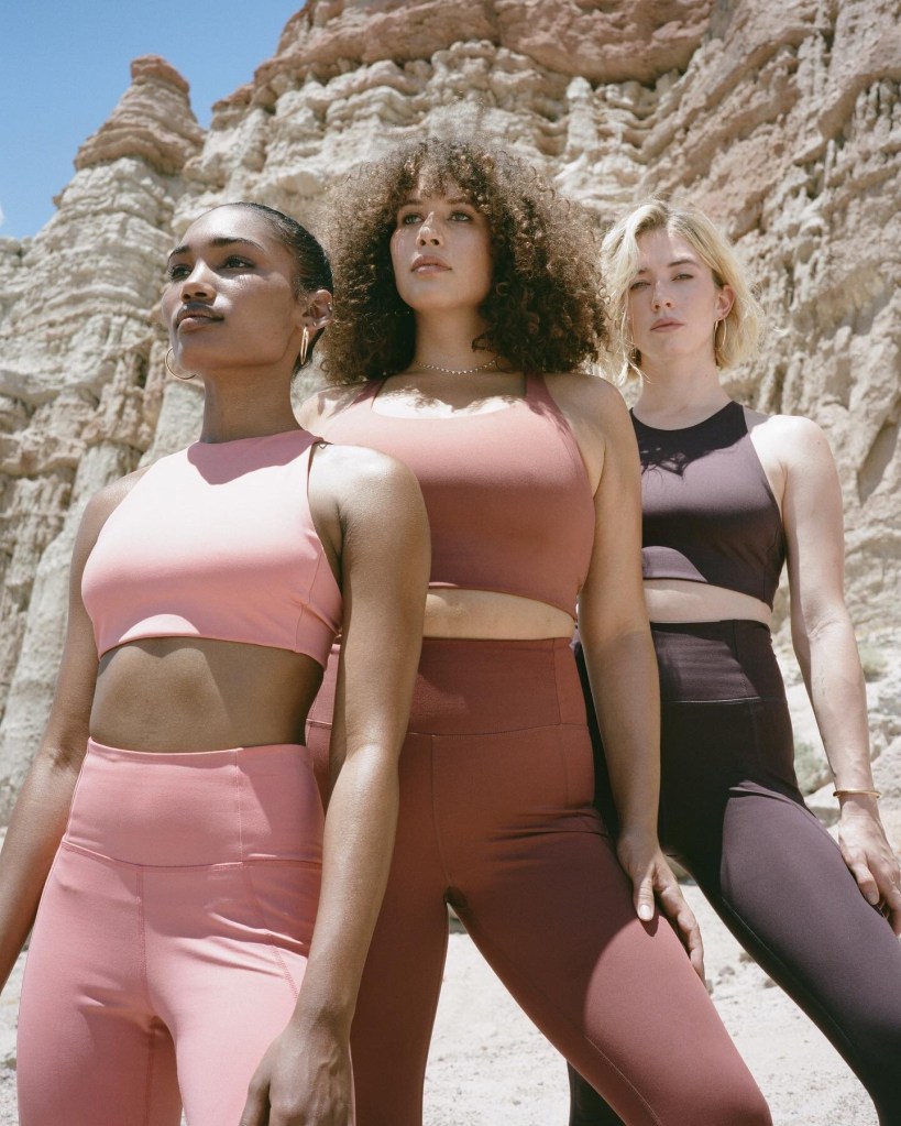 Three models wearing athleisure outfits