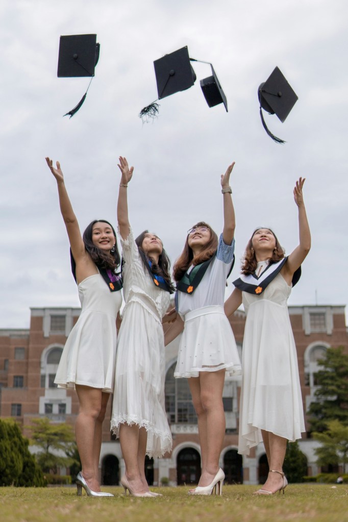 4 Asian women graduating college