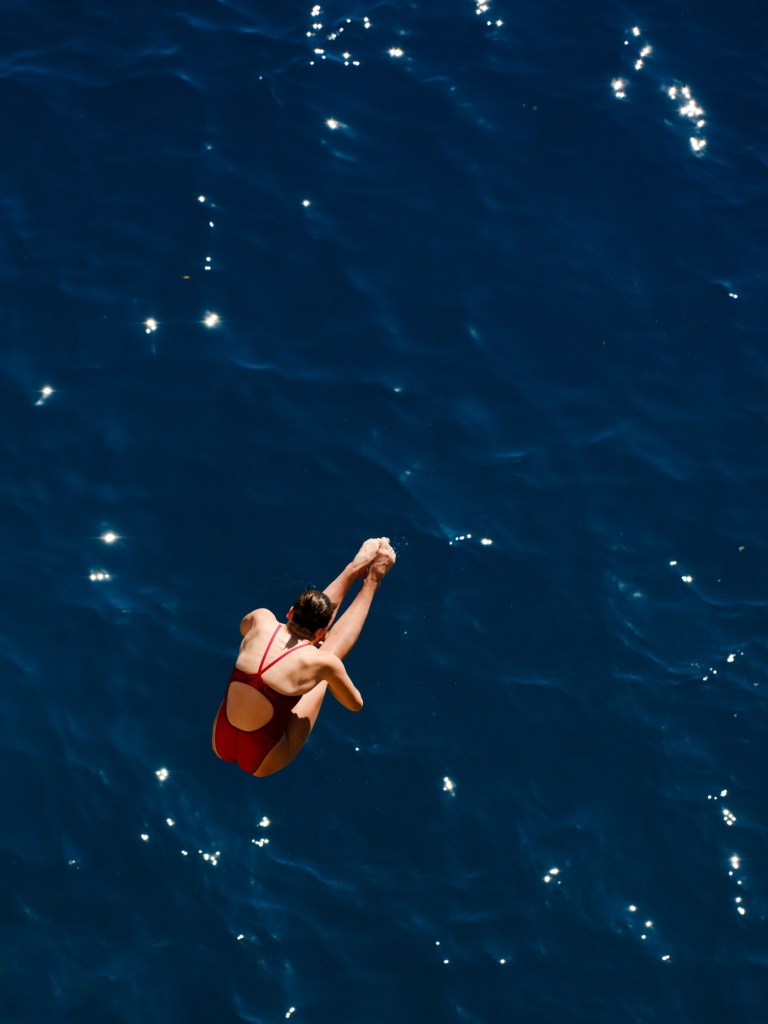 Female swimmer in red bathing suit 