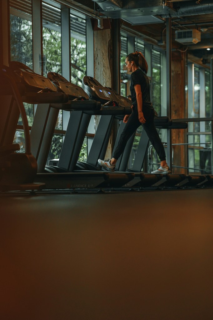 Woman walking on treadmill 
